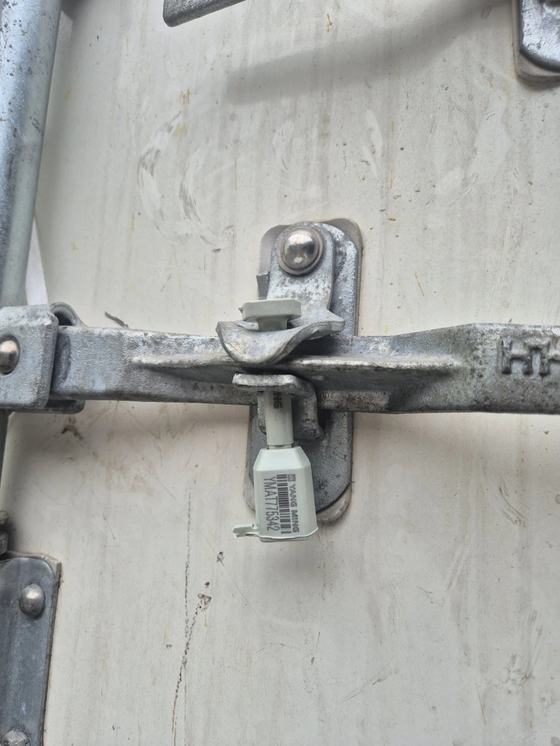 Tamper-evident seal applied at loading